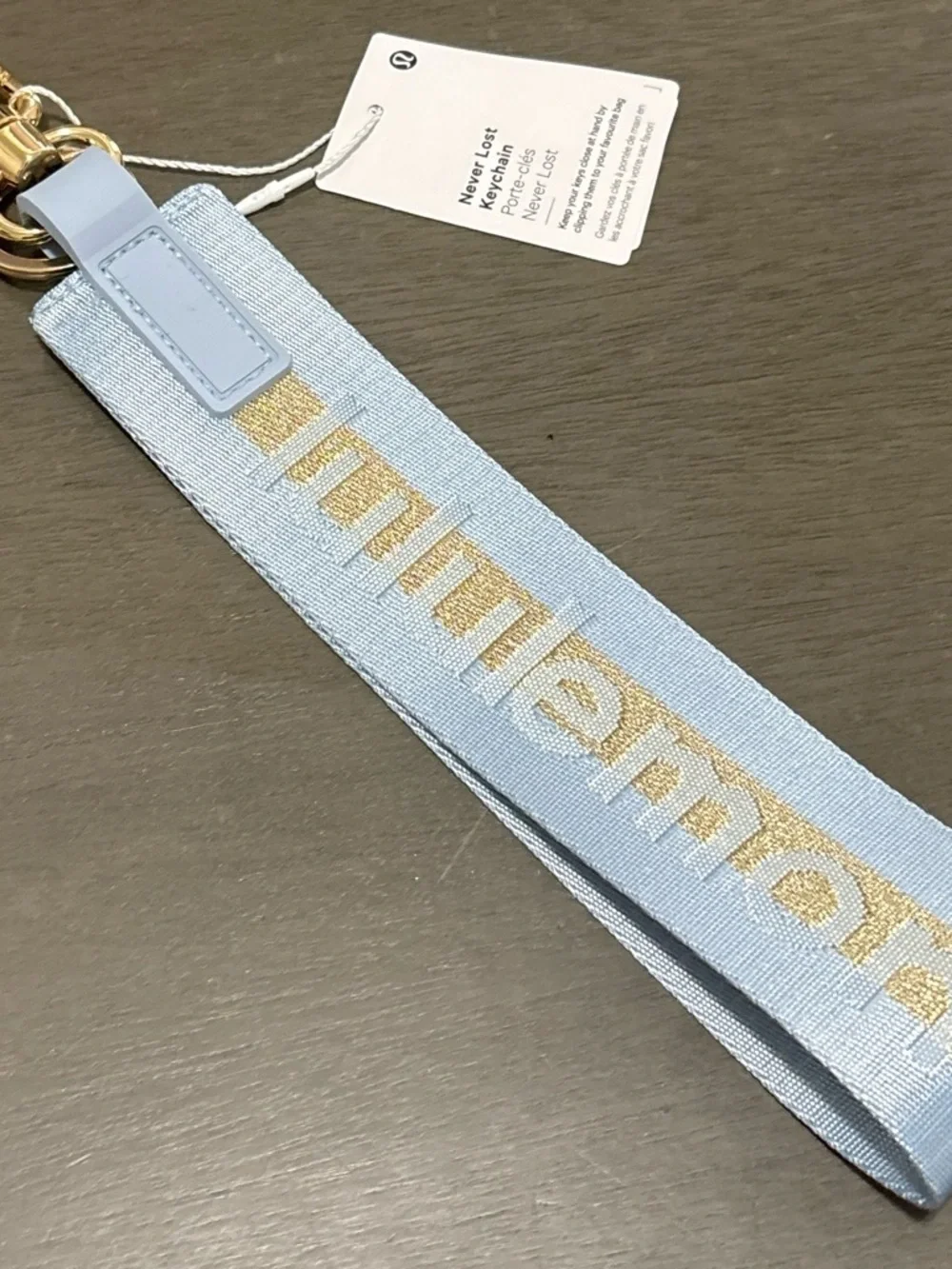 lululemon athletica light blue keychain wristlet with gold stripe
